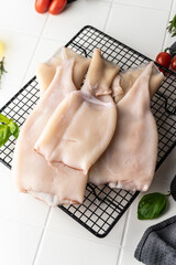 processed squid fillet. raw seafood. blank on a light background. preparation