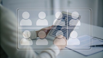 A person holding a tablet with virtual icons representing a team or online meeting interface overlayed.
