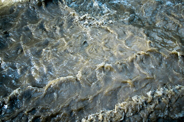 Muddy Flood Water in Turbulent Motion