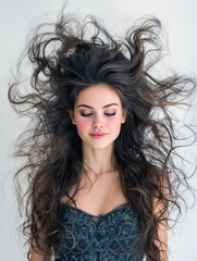 Naklejka premium Elegant woman with long, flowing hair. Peaceful atmosphere. Ideal for beauty, fashion, haircare.