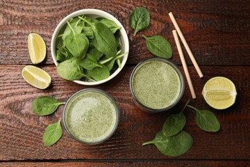 Tasty spinach smoothie and ingredients on wooden table, flat lay
