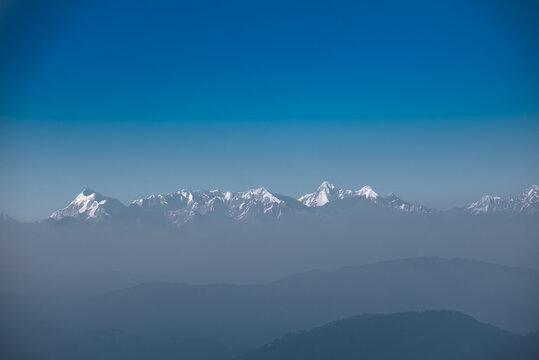 Panoramic View of White Snow Kumaon Himalaya Range notable peaks being Trishul, Nanda Devi, Nanda Kot, as seen from Uttarakhand