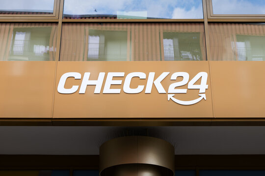 DRESDEN, GERMANY - 6. June 2025: CHECK24 logo sign of the online comparison portal on a building exterior. Close-up of the signage of the German business. Internet platform to compare prices and costs