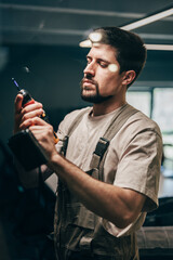 Craftsman working with a power drill in a modern workshop during daylight hours