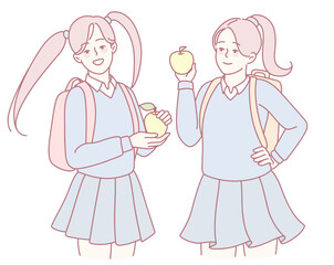Two cheerful schoolgirls joyfully hold colorful fruits, symbolizing friendship and healthy eating habits