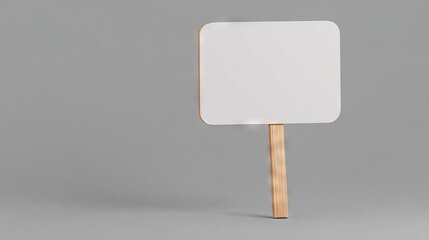 Blank sign mock up with wooden handle, placed against a smooth gray background, ideal for design projects, advertising, or promotional content creation