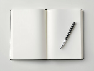 Open blank notebook with black pen on white surface for writing or note taking