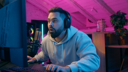 Caucasian man guy male gamer streamer playing online game shocked worried anxiety astonish shock at...