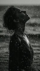 Emotional Downpour: Black and White Portrait of a Woman Immersed in Rain, Symbolizing Cleansing, Resilience, and Profound Contemplation in Nature