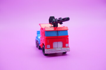 Transforming Truck Toy with Weapon Mounted on Roof