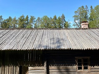 Rood construction. Old dilapidated ancient wooden house in the village. Finland, 19th century.