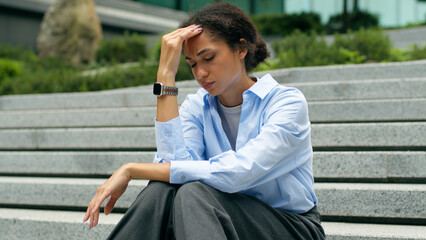 Tired troubled stressed African American businesswoman business woman girl female worker employer...