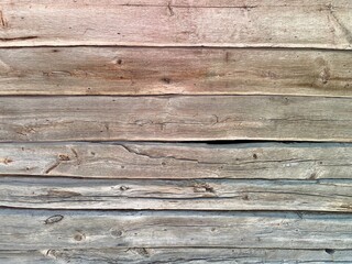 Wooden weathered surface. Old dilapidated ancient wooden house in the village. Finland, 19th...
