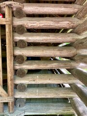Wooden log wall of an old barn. 19th century. Finland. Peasant house. 