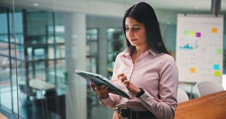 Business, planning and woman in office, tablet and check investment proposal with digital app. Person, employee or financial advisor in workplace, tech or internet with stock market or online reading - Powered by Adobe