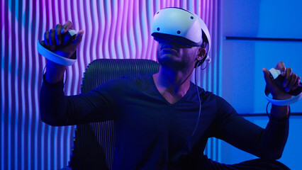 African American man guy male gamer gaming vr play wearing virtual reality glasses helmet three...