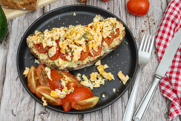 Delicious guacamole toast with fresh tomatoes