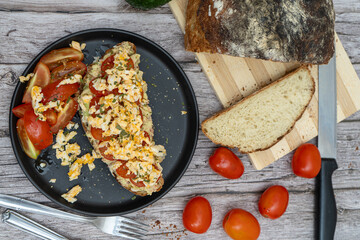Delicious guacamole toast with fresh tomatoes