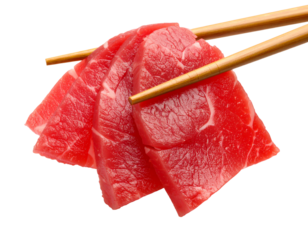 Fresh slices of sushi-grade tuna with chopsticks.