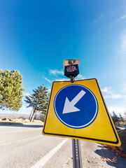 Road sign detour with flashing light on solar battery charger