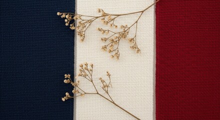 Dried floral arrangement on a tricolor textured textile backdrop pattern