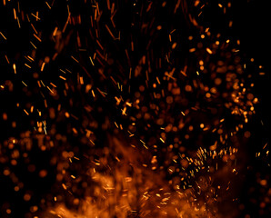The image is of a fire with a lot of smoke and sparks