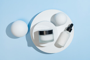 Minimalist white serum bottle and cream jar displayed on white round stand simple elegant beauty...