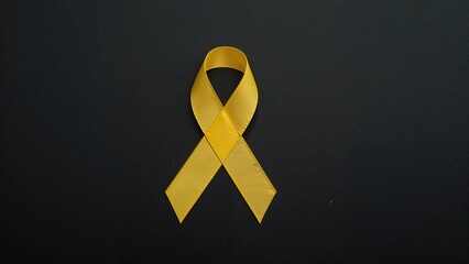 Yellow awareness ribbon symbolizing support and hope