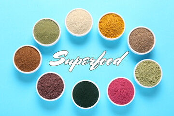 Superfood. Different powders in bowls on light blue background, flat lay