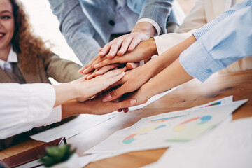 Office team collaboration symbolizing unity and teamwork with business colleagues joining hands...