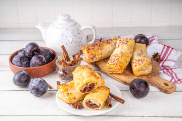 Vertuta, homemade strudel hand pies with sweet plum jam and spicy filling, with cinnamon, on a...