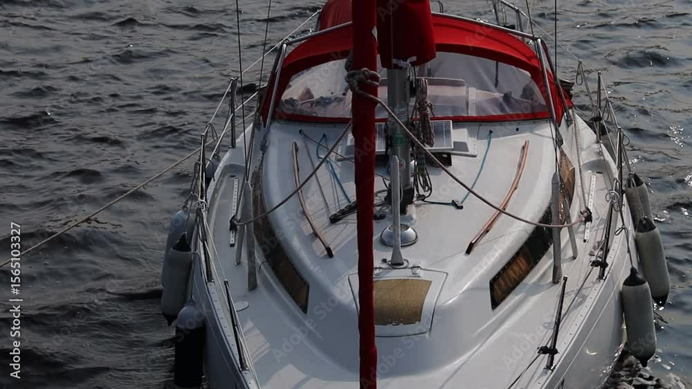 Poster a small white boat with a distinctive red bow floating on calm water