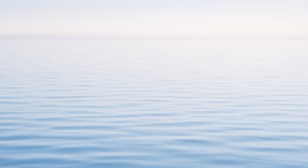 Obraz premium Serene Ocean Surface - Calm, tranquil ocean water with a soft, light blue hue. Perfect for backgrounds or peaceful themes