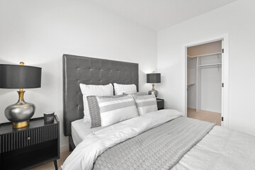 Bedroom with a large bed and two lamps