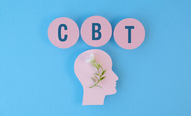 A head with a flower on it and the letters CBT