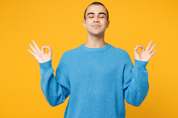 Young middle eastern man wearing blue sweatshirt casual clothes hold hands in yoga om aum gesture...