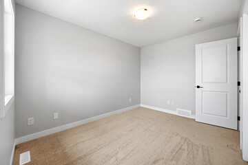 White room with a door and a window