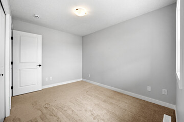 White room with a door and a window