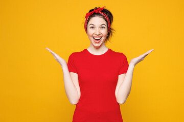 Young shocked surprised overjoyed excited cool satisfied woman she wearing red t-shirt casual...