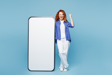 Full body young ginger woman wear shirt t-shirt casual clothes big huge blank screen mobile cell...