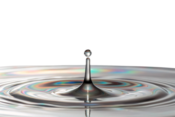 Perfect water droplet creating concentric ripples with iridescent rainbow reflections on pristine liquid surface below, isolated on a transparent background