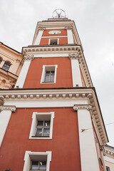 A striking tower in St Petersburg, showcasing its detailed architecture and vibrant colors against...