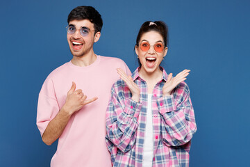 Young couple two friends family man woman they wear pink casual clothes sunglasses together show...