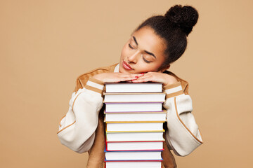 Young sleepy smart girl student wearing casual clothes backpack bag hold put head on stack of many...