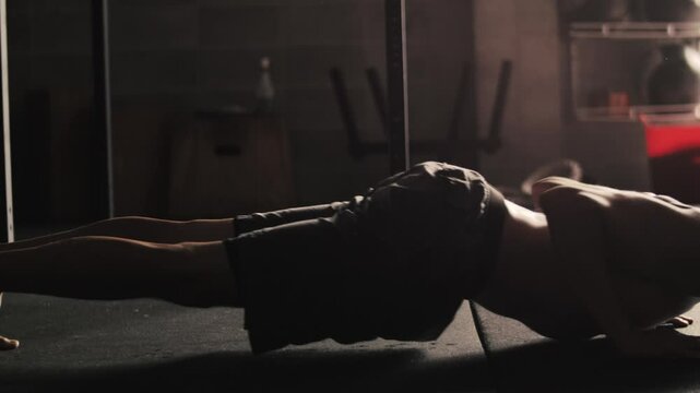 Push ups performed by man in a gym during workout session in the morning