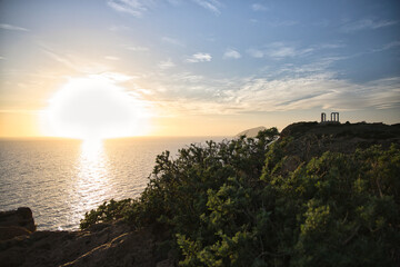 The hills near the Temple of Poseidon fade during a spring sunset.