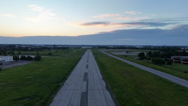 Low-angle drone simulates takeoff from Buttonville Airport, lifting from the ground to reveal the full decommissioned runway from above in POV style