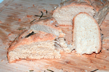 Close up of home made focaccia bread ready baked in the oven with rosemary