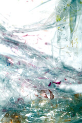 Absract background of shiny plastic and bubbles dreating bright sci-fi style texture background