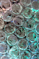 Absract background of shiny plastic and bubbles dreating bright sci-fi style texture background